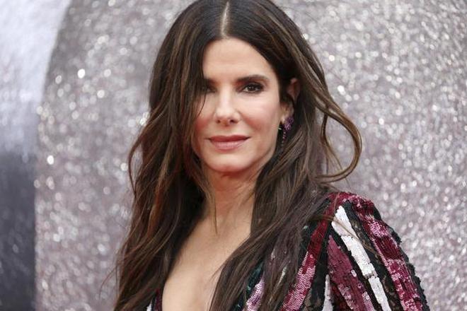 Actress Sandra Bullock poses for photographers upon arrival at the premiere of the film 'Ocean's 8' in central London.