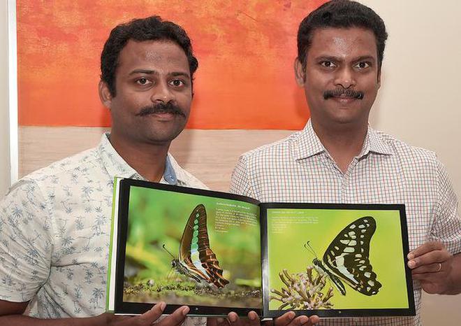 P. Mohanprasath and N. Satheesh with their book Butterflies of Tamil Nadu in Chennai.