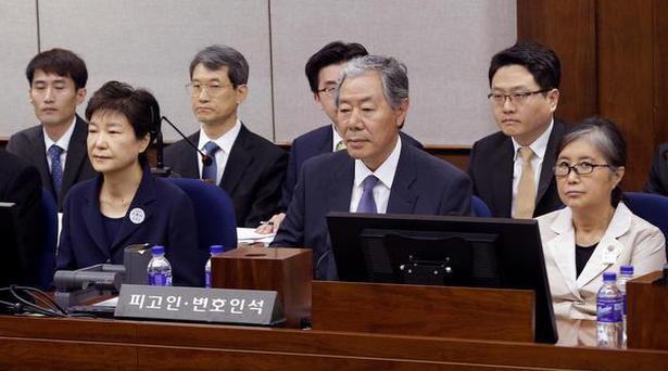 Former South Korean President Park Geun-hye, front left, sits with her longtime friend Choi Soon-sil, right, for her trial at the Seoul Central District Court in Seoul on May 23, 2017.