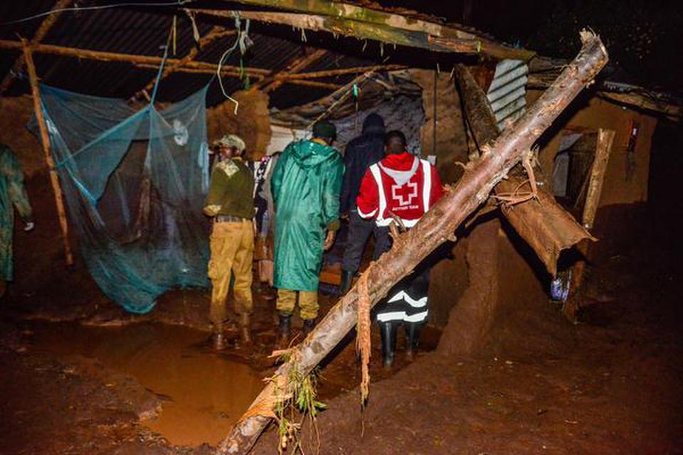 volunteers scour for survivors in a residential area on May 10, 2018 after a dam burst its bank at Solai, about 40 kilometres north of Nakuru, Kenya. So far, 20 bodies have been recovered.   | Photo Credit: AFP