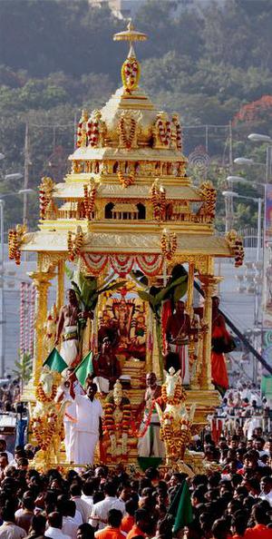 Tirupati : The sacred golden chariot procession of Lord Venkateswara being taken out on the penultimate day of Navaratri Brahmotsavam festival at Tirumala in Tirupati on Wednesday. PTI Photo(PTI10_21_2015_000141B)