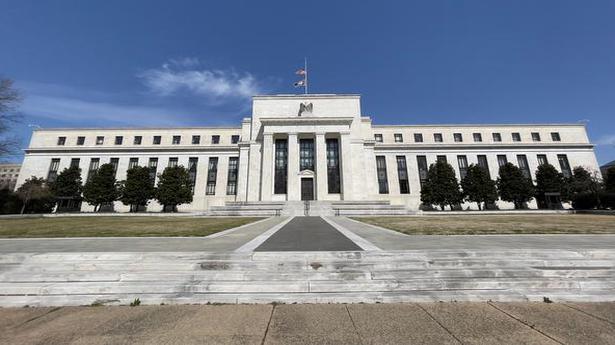 Fed notes improving economy, a step toward easing support