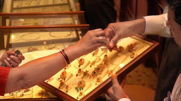 Gold marginally lower; silver tumbles ₹ 515