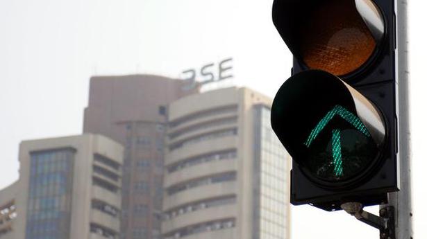 Sensex, Nifty surge to record highs