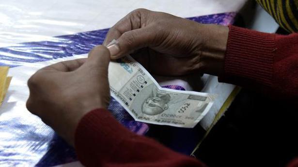 Rupee slips 15 paise to 74.70 against US dollar in early trade