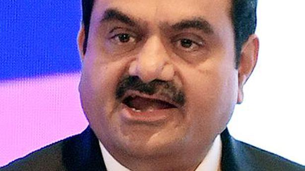 Adani Group shares close on a mixed note