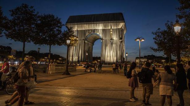 In artist Christo posthumous tribute, Arc de Triomphe wrapped in silvery blue