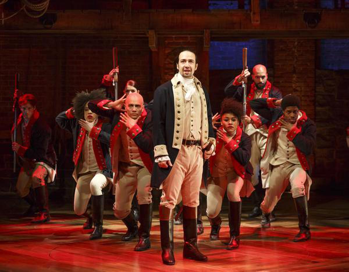 This image released by The Public Theater shows Lin-Manuel Miranda, foreground, with the cast during a performance of ‘Hamilton’ in New York.