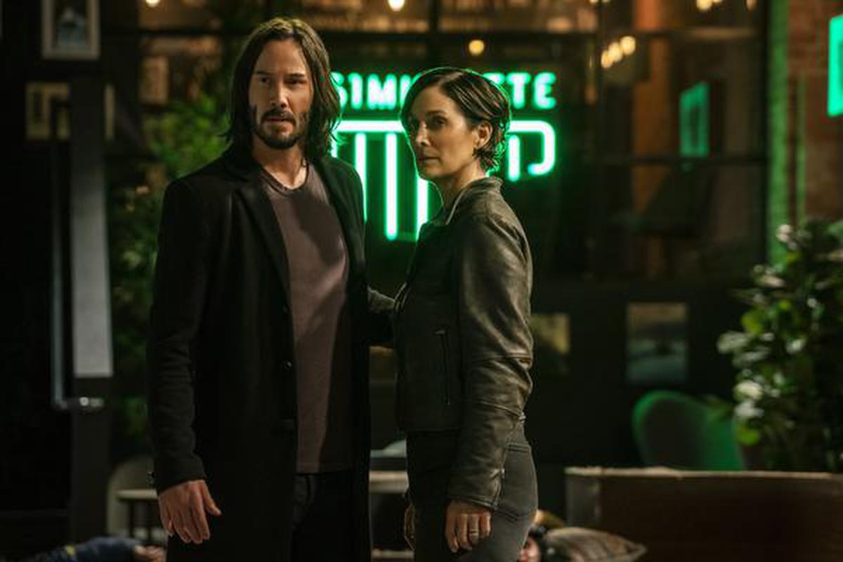 'The Matrix Resurrections' with Keanu Reeves as Neo/Thomas Anderson and Carrie-Ann Moss as Trinity in a still film from Warner Bros.