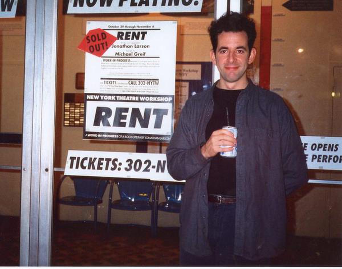 An archival photograph of playwright-composer Jonathan Larson standing outside a sold out theatre to play ‘Rent’
