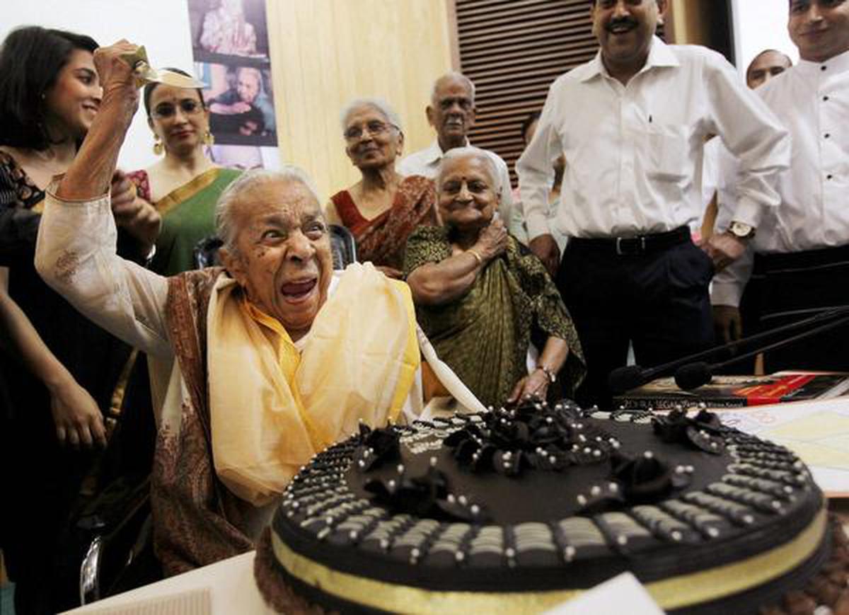 Veteran actress Zohra Sehgal reacts while cutting cake on her 100th birthday in New Delhi in April 2012.
