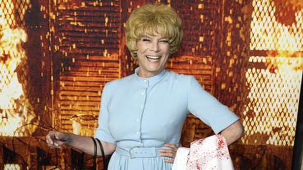 Jamie Lee Curtis dresses up as her mum’s ‘Psycho’ character to ‘Halloween Kills’ premiere