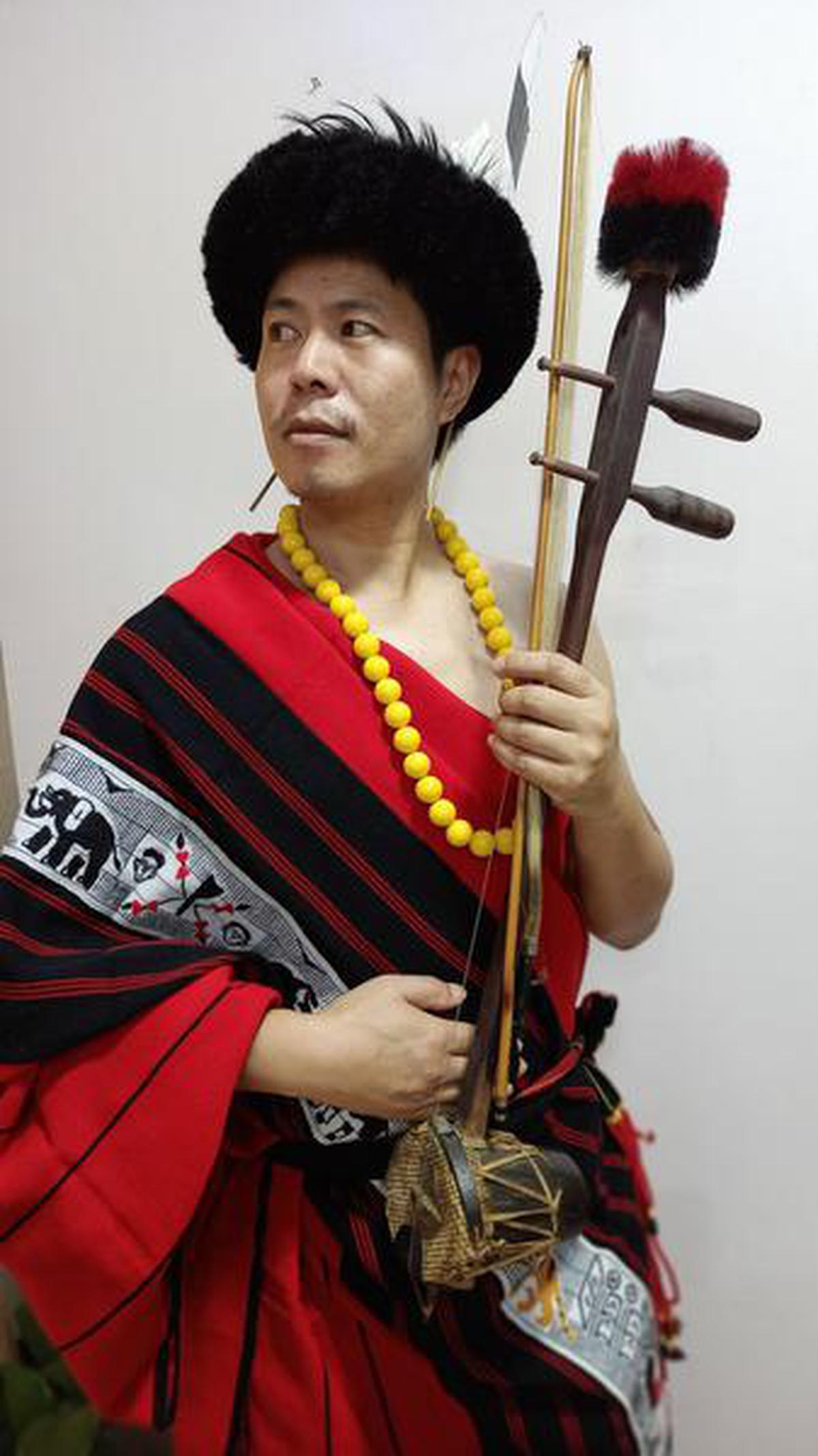 Naga folk musician Atso Chasie with the Gei-Ü, the string instrument he developed