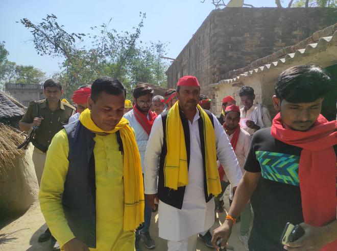 SBSP leader Sanjay Rajbhar (left) with SP workers in Gopalpur constituency.  