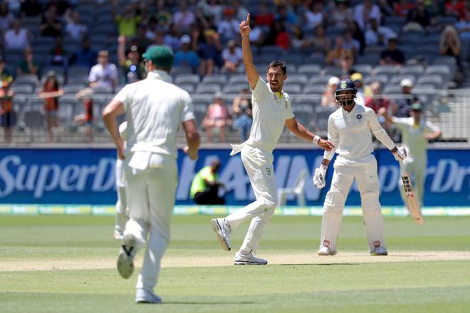 Australia's Mitchell Starc celebrates after dismissing India's Hanuma Vihari on day five of the second test match between Australia and India at Perth Stadium in Perth, Australia, December 18, 2018.