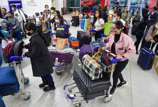 Indian nationals, evacuated from war-torn Ukraine, upon their arrival at the IGI Airport, in New Delh. Air India’s second evacuation flight from Romanian capital Bucharest carrying 250 Indian nationals who were stranded in Ukraine landed at the airport in the early hours of February 27, 2022