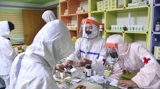 North Korea reports surge in fever as Kim Jong Un claims virus progress