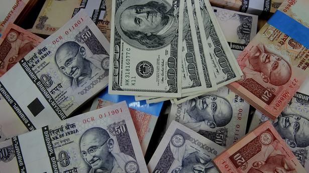 Rupee slips 2 paise to close at 77.57 against U.S. dollar