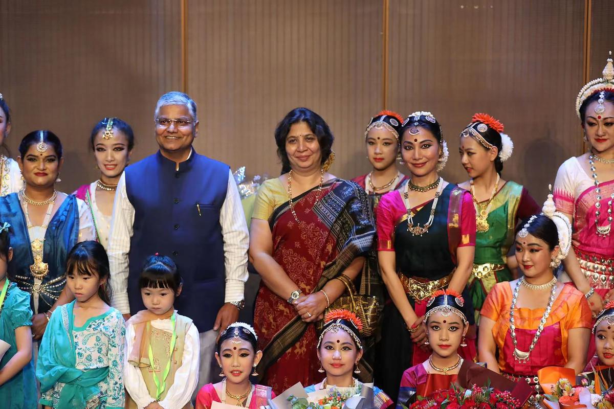 Ambassador of India to China Pradeep Kumar Rawat and with his wife Shruti Rawat with students and admirers who took part in a special show to pay tribute to Zhang Jun, in Beijing, on June 24, 2022.