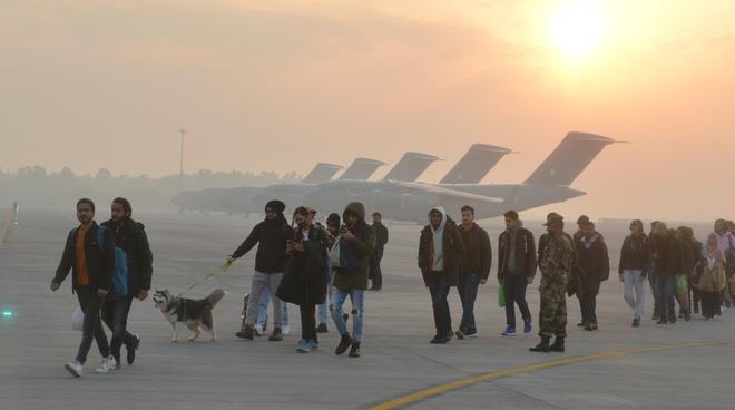 Students with arrive at Hindan Airbase after being evacuated from the conflict hit zone of Ukraine from Poland by the IAF C 17 Globemaster Aircraft in Ghaziabad on March 3, 2022. 