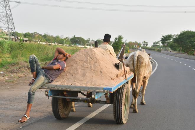 High road: Sand-laden carts finally take the Chennai-Kolkata highway.
