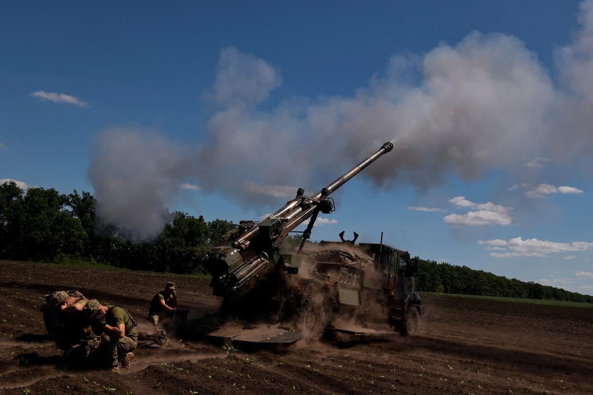 Ukrainian service members fire toward Russian positions with a CAESAR self-propelled howitzer, as Russia’s attack on Ukraine continues, in Donetsk Region, Ukraine on June 8, 2022. 
