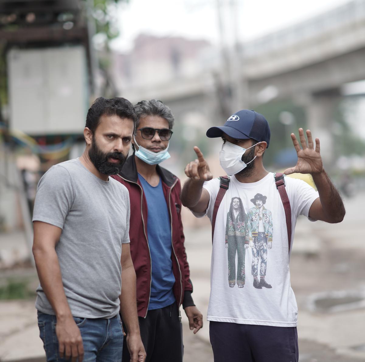 Vineeth Kumar (left) with cinematographers Sameer Thahir and Shyju Khalid, who are also producers of 'Dear Friend'