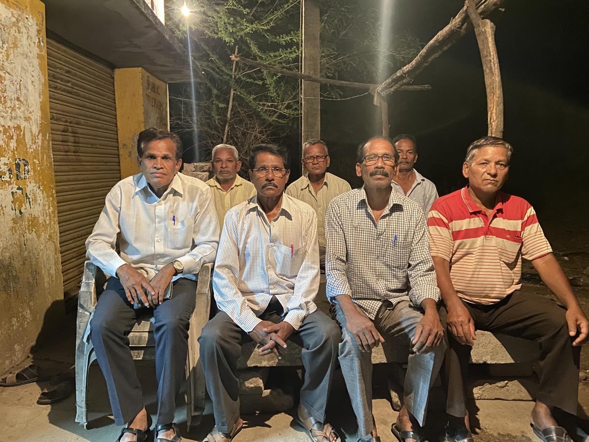 A group of former employees of CCI at a  kirana shop in the CCI Township, Adilabad. 