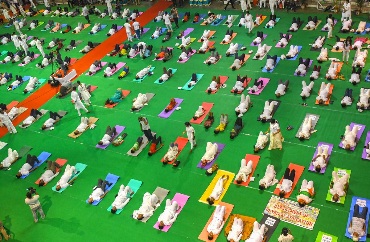 Participants at a programme at Swarna Bharathi Indoor Stadium organised on the occasion of International Day of Yoga in Visakhapatnam on Tuesday, June 21, 2022.
