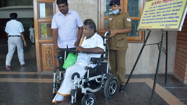 Differently abled persons get battery-operated wheel chair at Salem Collectorate