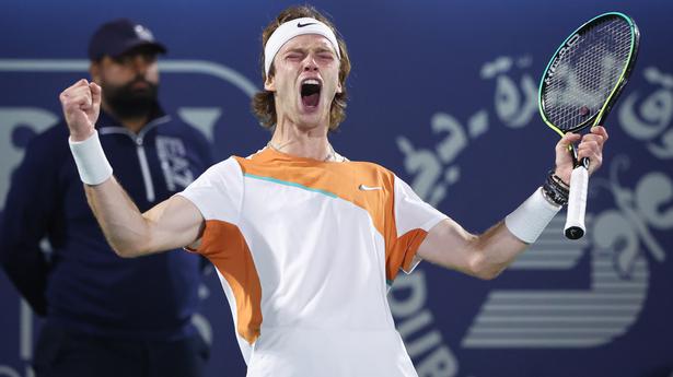 Russian tennis star Andrey Rublev writes 'No War Please' on TV camera after win