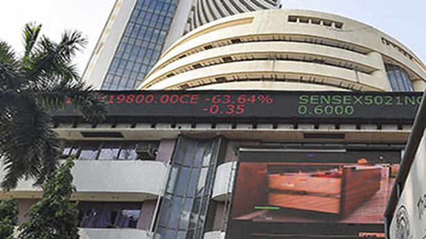 Rupee hits fresh low, equities gain 1%