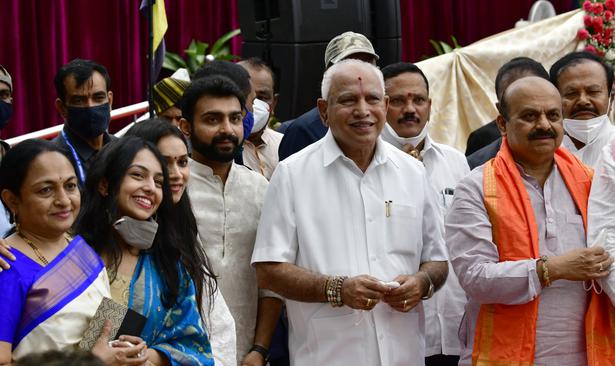 Former chief minister B.S. Yediyurappa with the family members of Basavaraj Bommai (right) who was sworn-in as Chief Minister of Karnataka, at Raj Bhavan in Bengaluru on July 28, 2021.