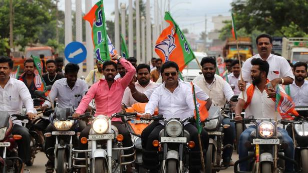 MP leads bike rally without helmet
