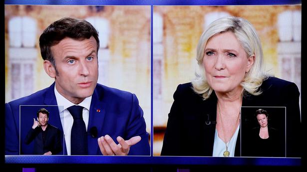 Macron attacks Le Pen on Russia, Muslim headscarf ban pledge