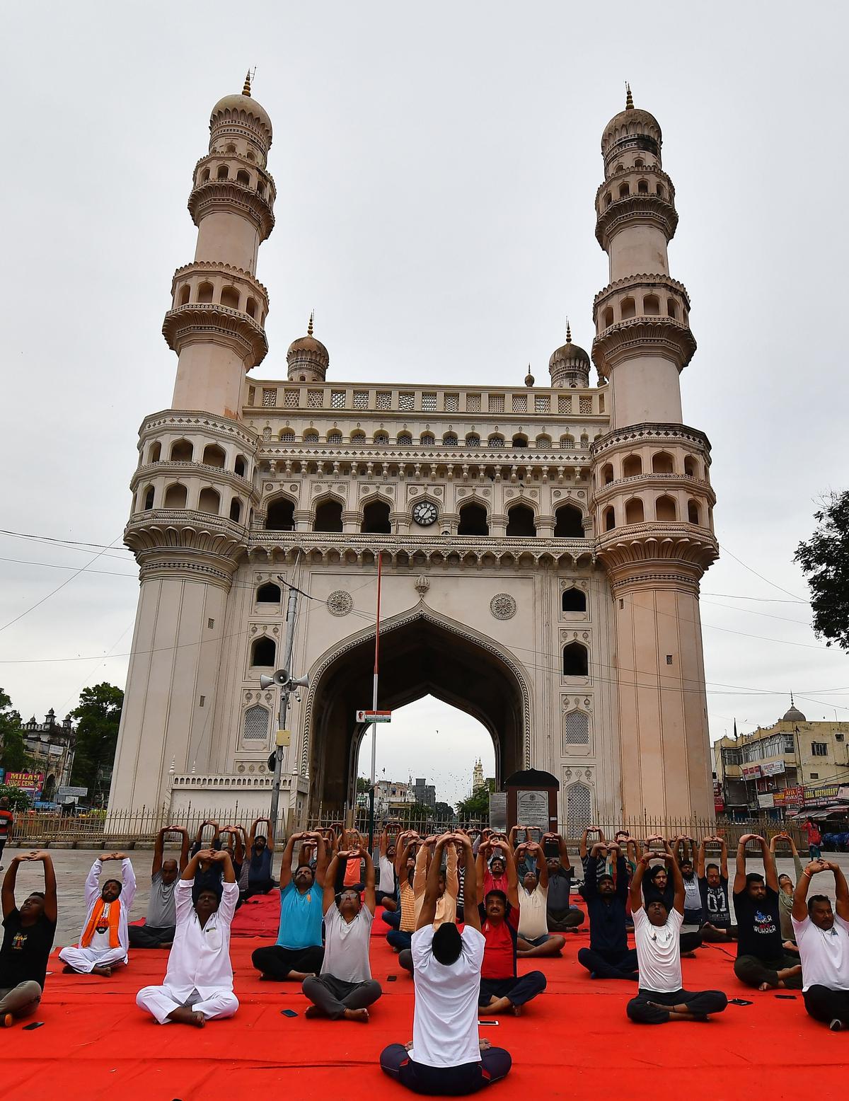 Participants performing yoga at Charminar in the old city of Hyderabad.