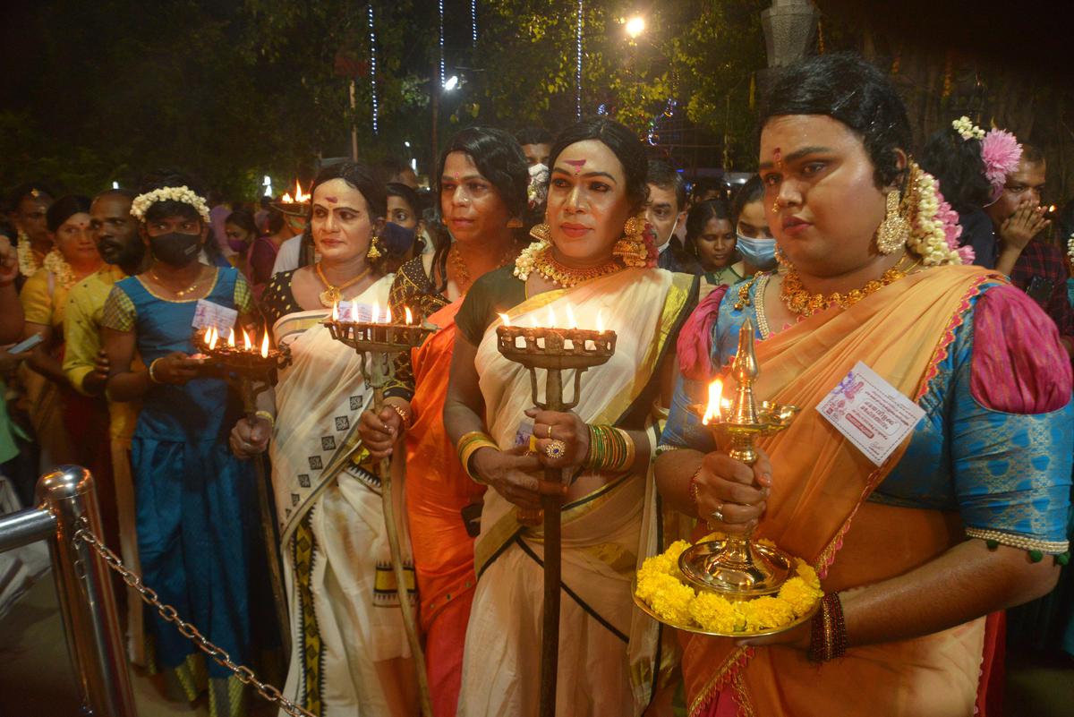 Men dolled up as women taking part in the Chamayavilakku ritual to propitiate the deity as part of the annual festival of the Chavara Kottankulangara Devi temple in Kollam on Thursday. 