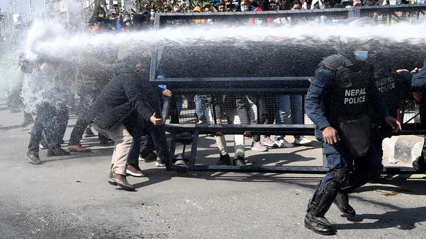 Nepal police fire tear gas as MPs debate U.S. grant