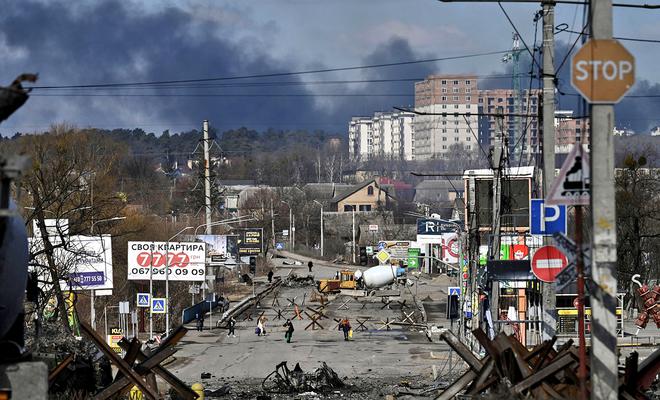 Residents evacuate the city of Irpin, north of Kyiv, on March 10, 2022. 