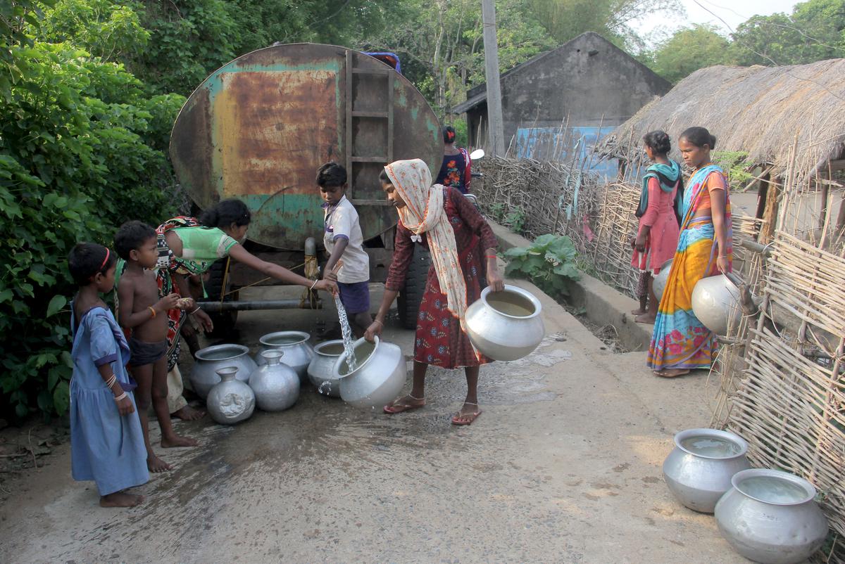While traversing the dusty roads of Ranipokhari, one can spot many teenage girls doing household chores. A scene at the government distribution tank near Sarata village in Mayurbhanj district.