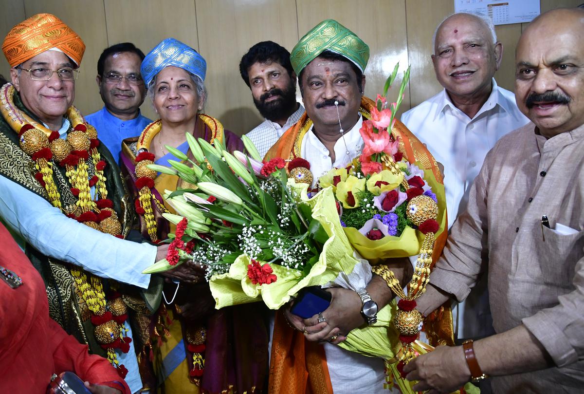 Karnataka Chief Minister Basavaraj Bommai greets newly-elected BJP Rajya Sabha members at the Vidhana Soudha in Bengaluru on June 10, 2022.