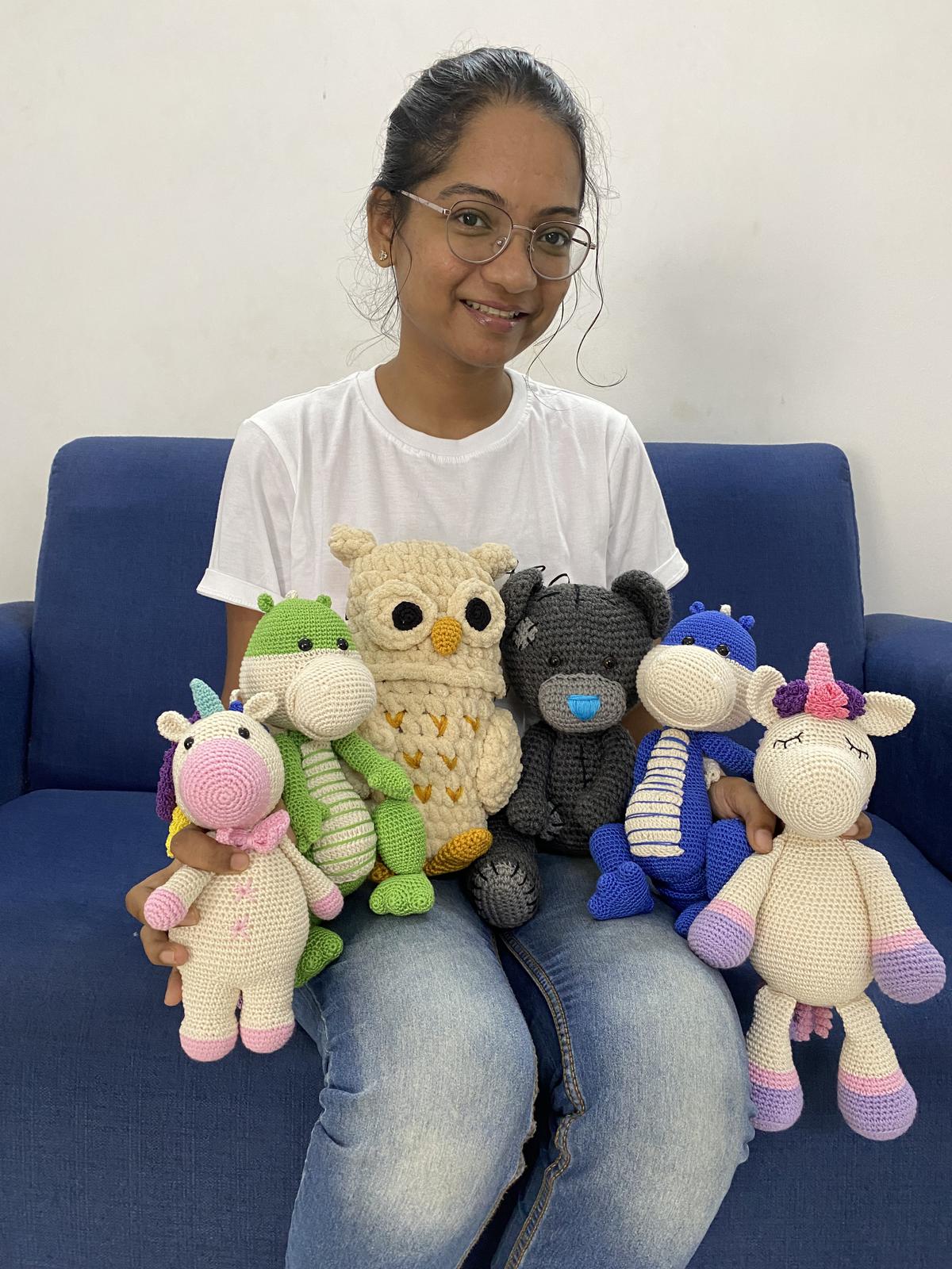 Priya Ayyappan with the Amigurumi toys crocheted by her 