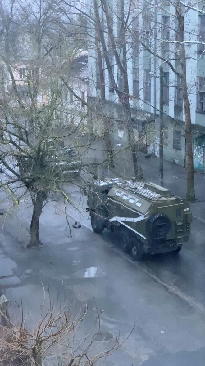 A military truck and tank are seen on a street of Kherson, Ukraine on March 1, 2022, in this screen grab from a video obtained by Reuters on March 2, 2022. 