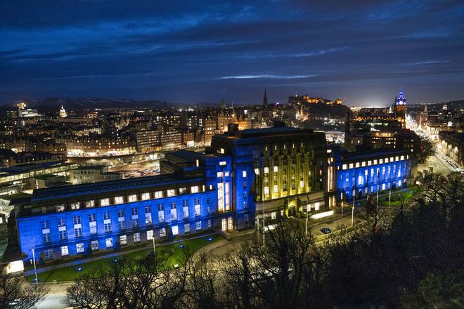 St Andrew’s House in Edinburgh, Scotland, is lit up with the colours of the Ukraine flag on February 25, 2022. 