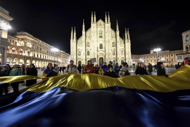 People gather to demonstrate in Duomo Square, Milan, Italy on February. 25, 2022.