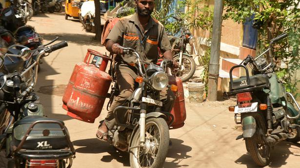Gas cylinder delivery men weighed down by low wages