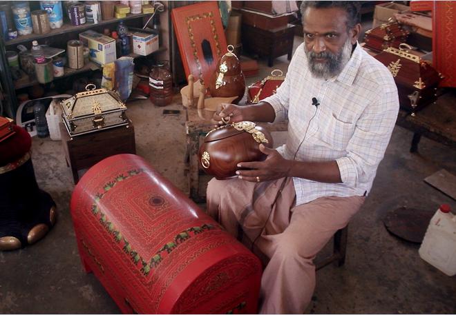 Master craftsman VV Suresh Kumar working on an atta petti, which was once used to store costumes of Kathakali artistes