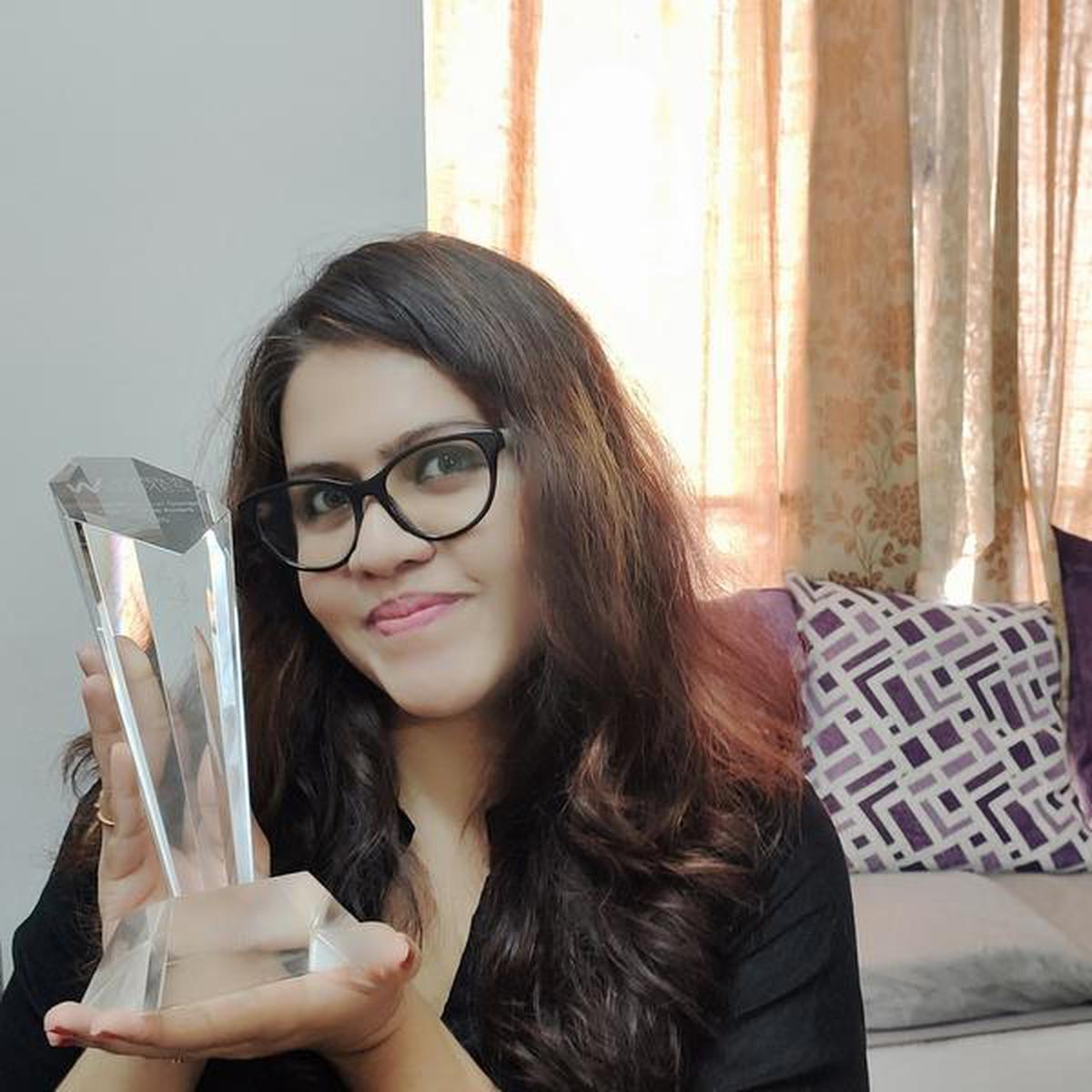 Poornima Seetharaman with her induction award for ‘Women in Games — Global Hall of Fame’