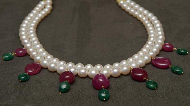 Mita Banker’s pearls on Zoom and suits