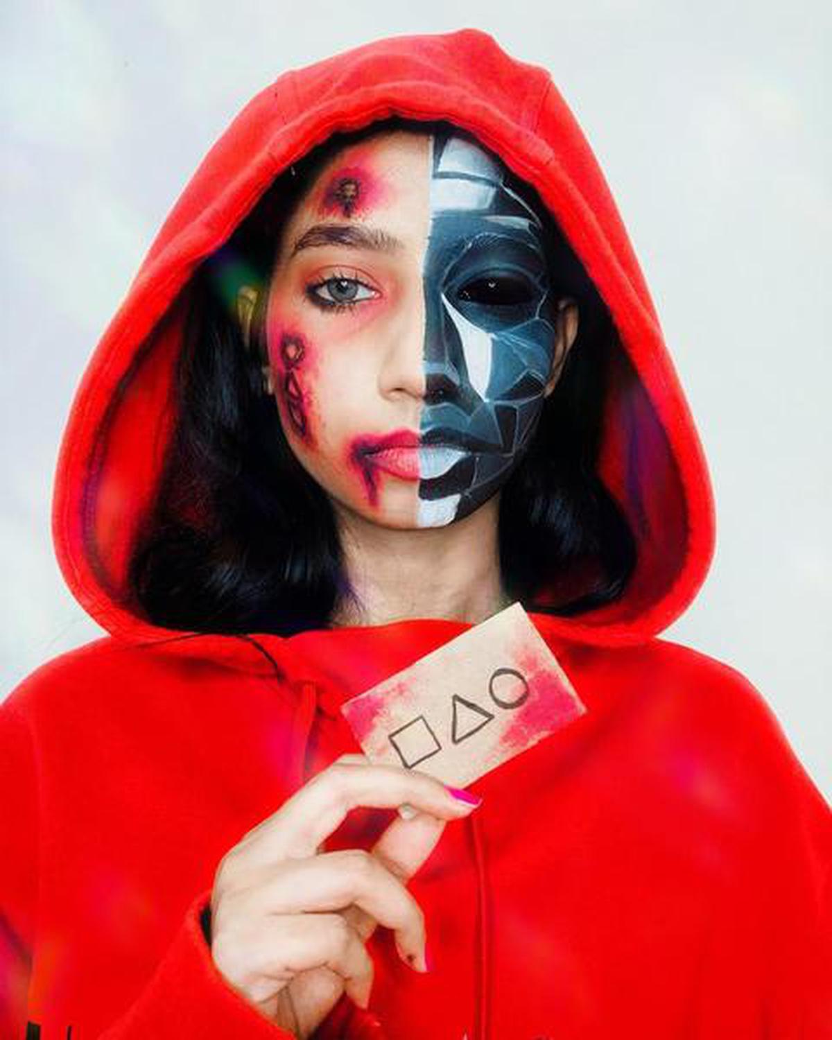 Swati Chatruverdi in a half-and-half make-up look featuring the Front Man and the look of the guards from Korean series ‘Squid Game’